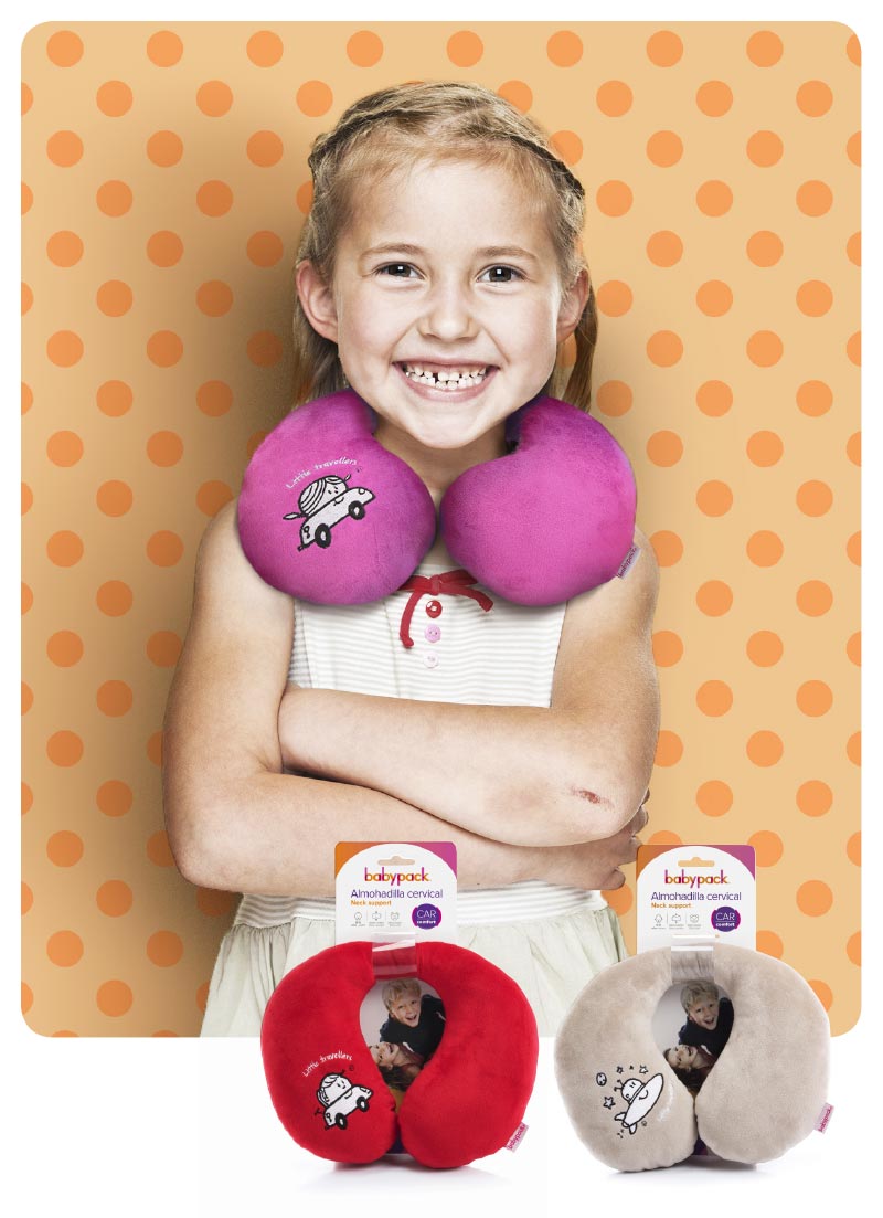 Toddler girl wearing travel neck support.